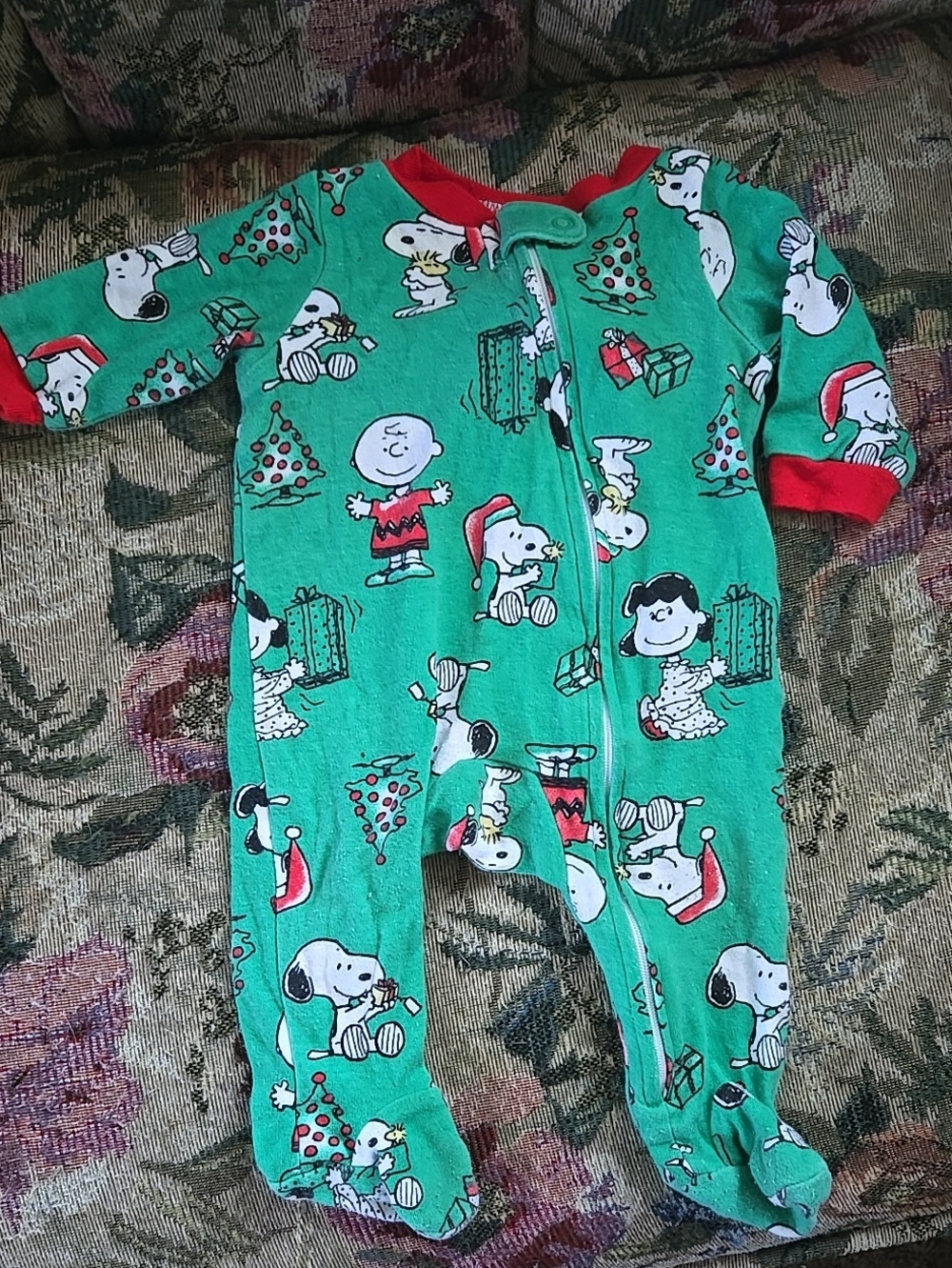 Peanuts Green Holiday Print Footed One-Piece by Peanuts with Red Trim